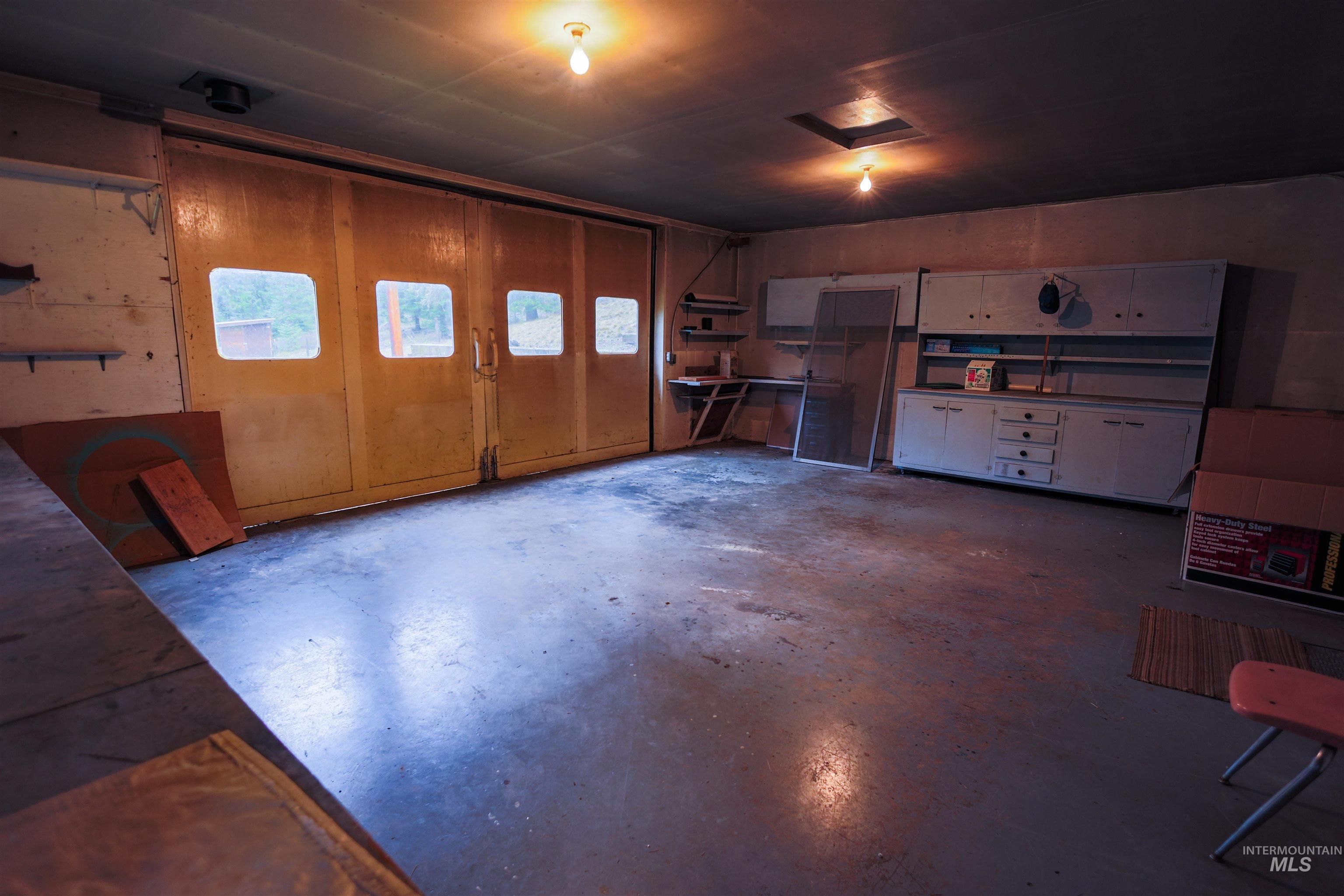 717 Big Cedar Road Kooskia, ID 83539 - Photo 24 of 50 Miscellaneous room with concrete floors and attic access