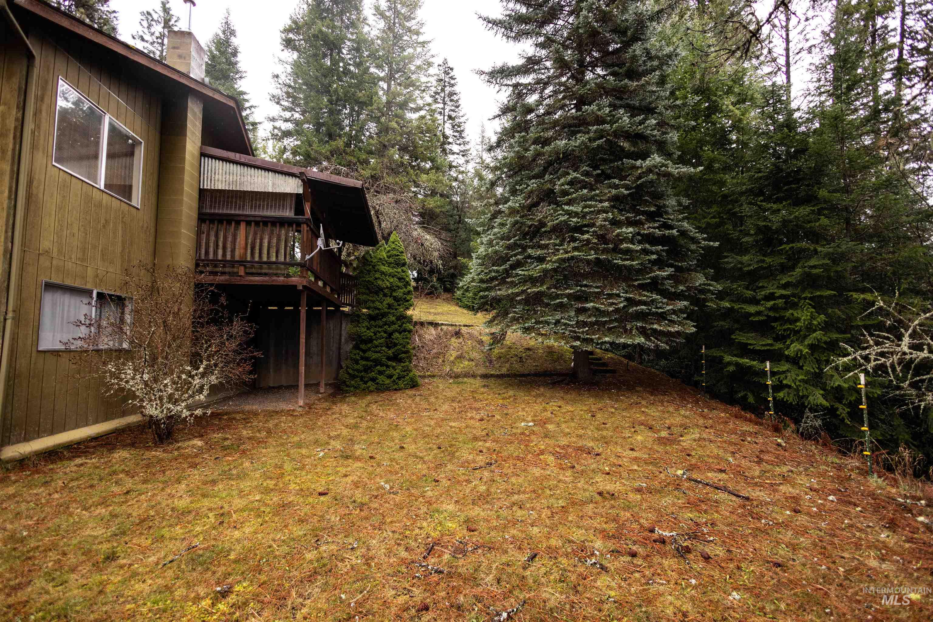 717 Big Cedar Road Kooskia, ID 83539 - Photo 29 of 50 View of grassy yard featuring a wooden deck