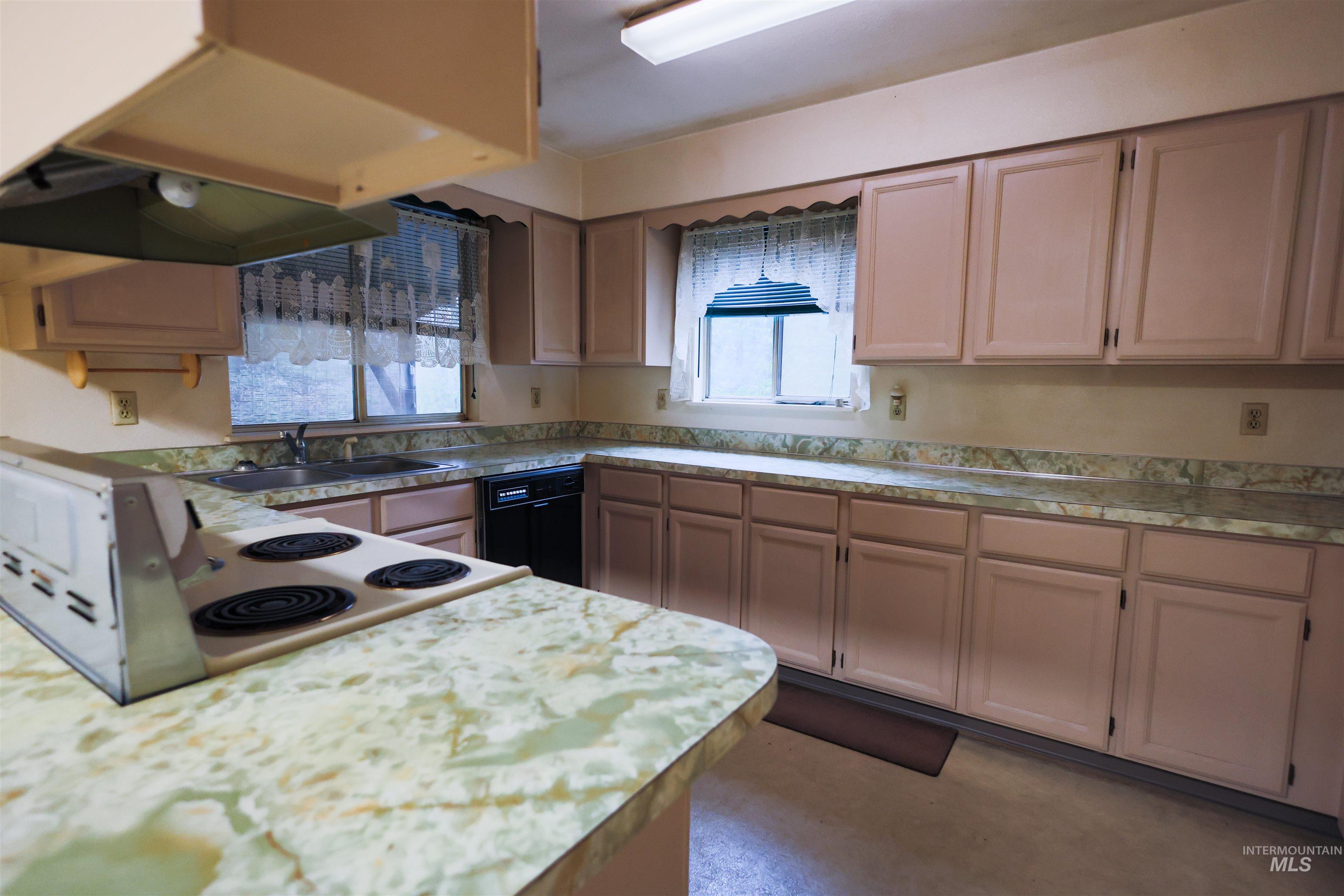 717 Big Cedar Road Kooskia, ID 83539 - Photo 3 of 50 Kitchen featuring light countertops and black dishwasher