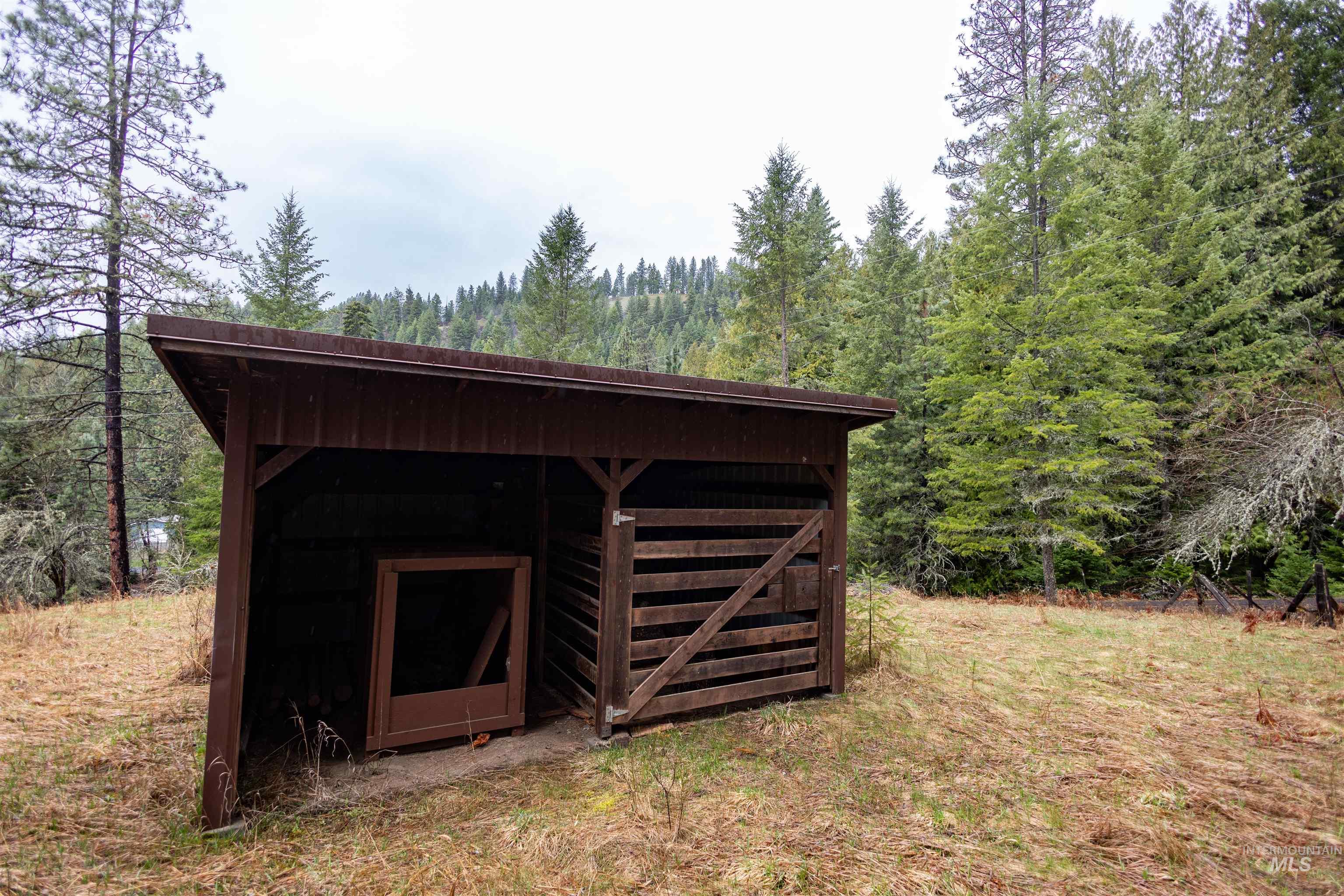 717 Big Cedar Road Kooskia, ID 83539 - Photo 38 of 50 View of pole building featuring a forest view