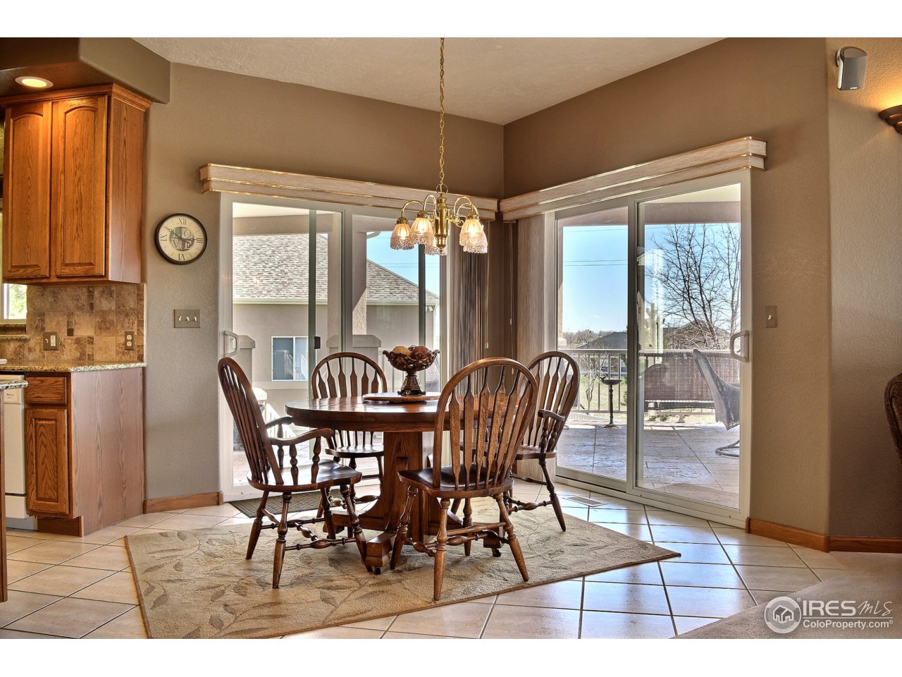 6120 Ashcroft Road Greeley, CO 80634 - Photo 11 of 25 Kitchen Dining with Easy Access To Deck