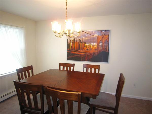 112 Sibley Road Waltham, MA 02453 - Photo 11 of 20 a view of a dining room with furniture