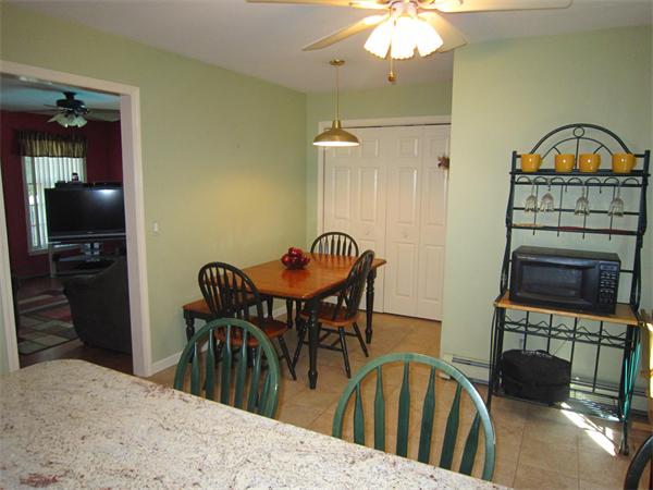112 Sibley Road Waltham, MA 02453 - Photo 6 of 20 a view of a a dining room with furniture window and wooden floor