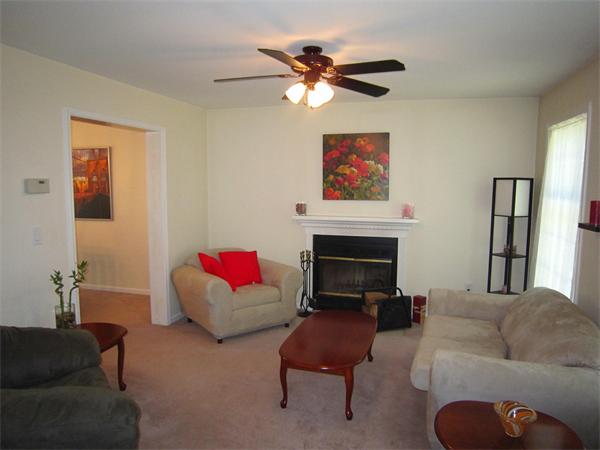 112 Sibley Road Waltham, MA 02453 - Photo 9 of 20 a living room with furniture and a fireplace