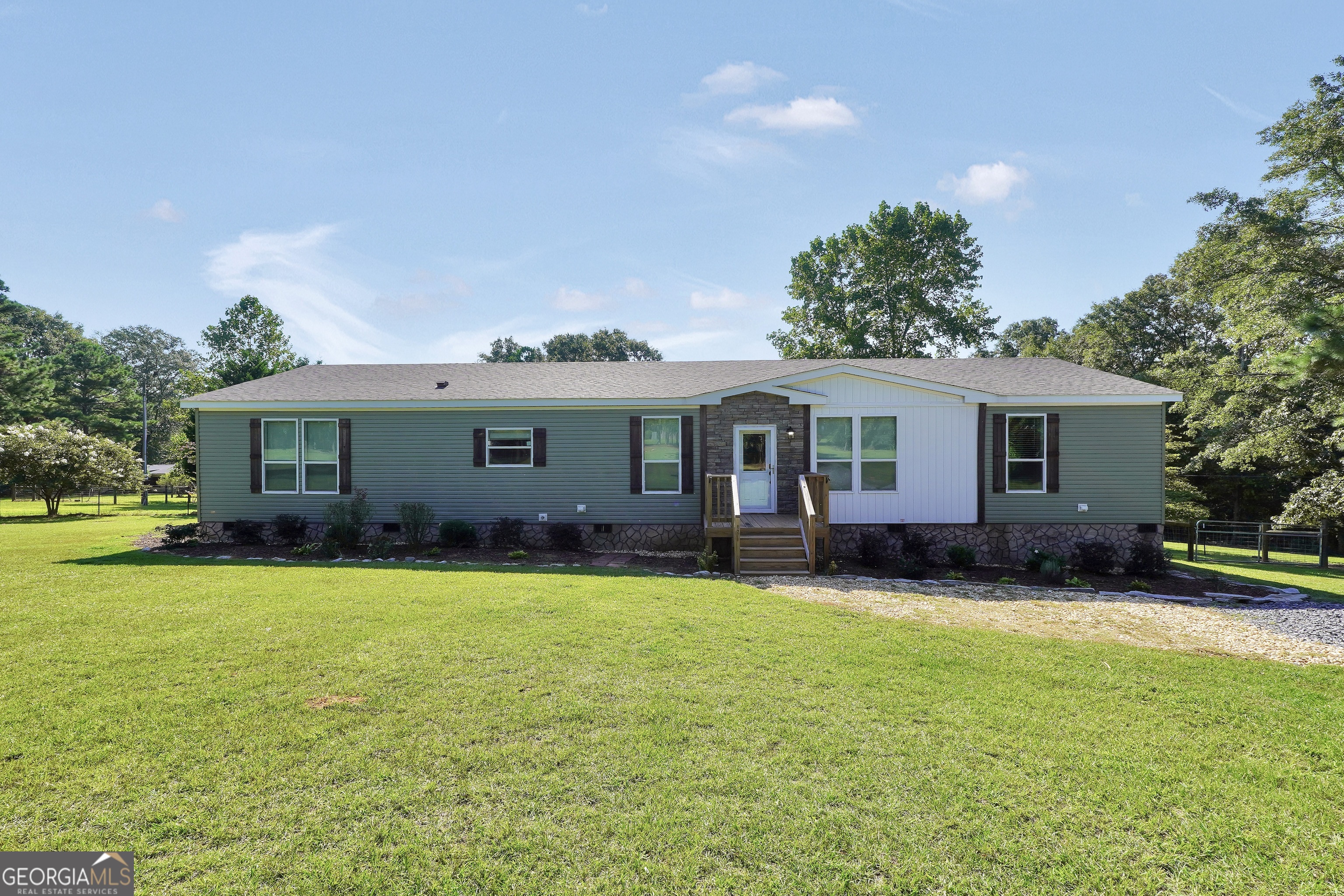 866 Firetower Road Thomaston, GA 30286 - Photo 1 of 1 a view of a house with a yard and sitting area