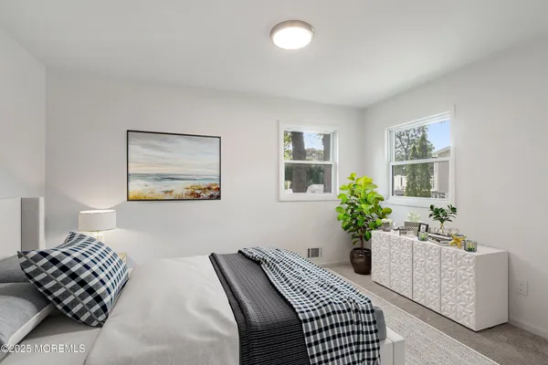 a bedroom with furniture and a bed