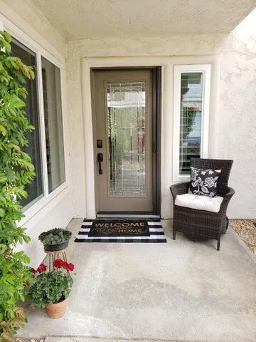 a swimming pool with outdoor seating and garden