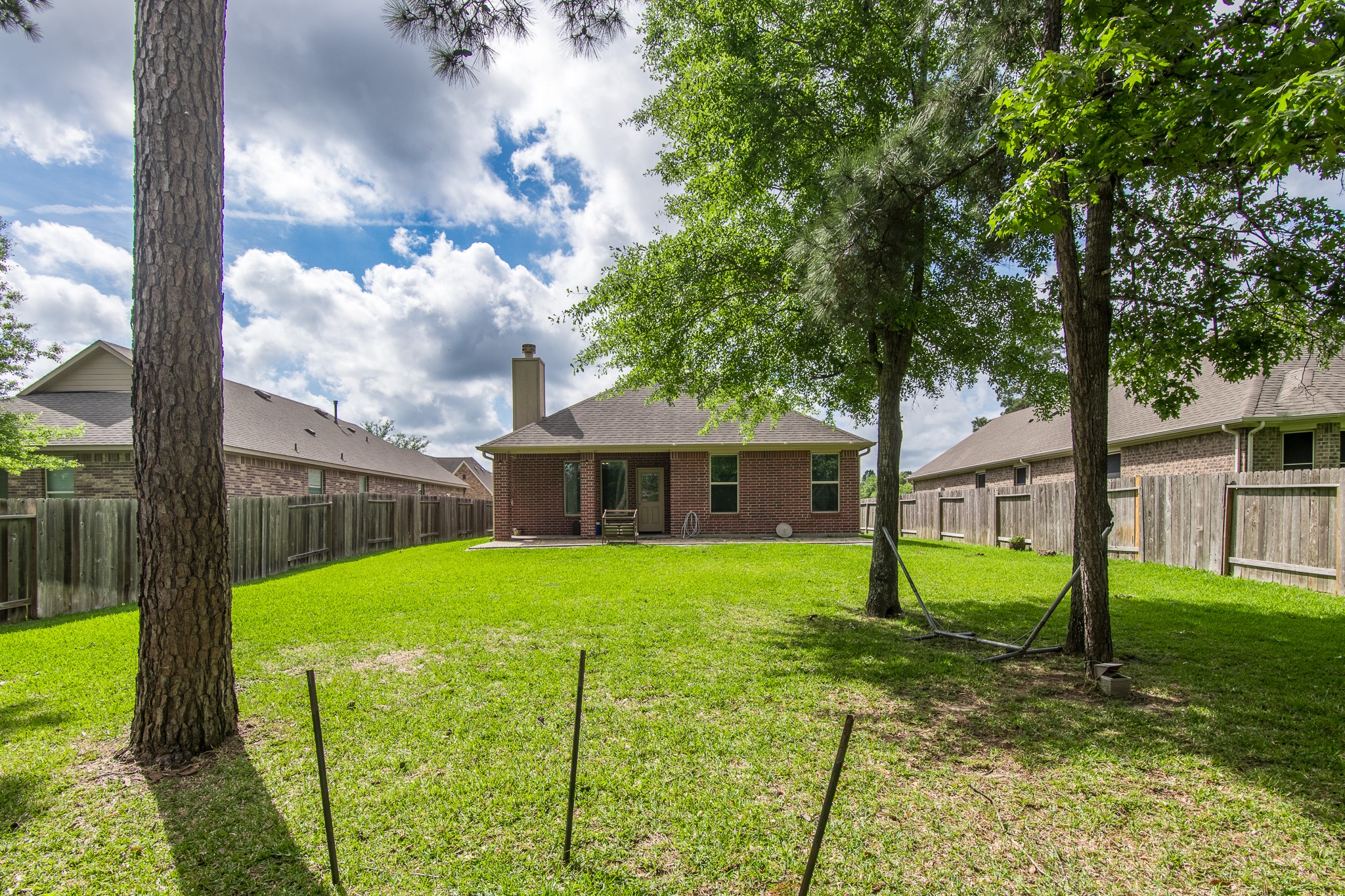 3211 Discovery Lane Conroe, TX 77301 - Photo 20 of 22 Spacious backyard with mature trees and no back neighbors