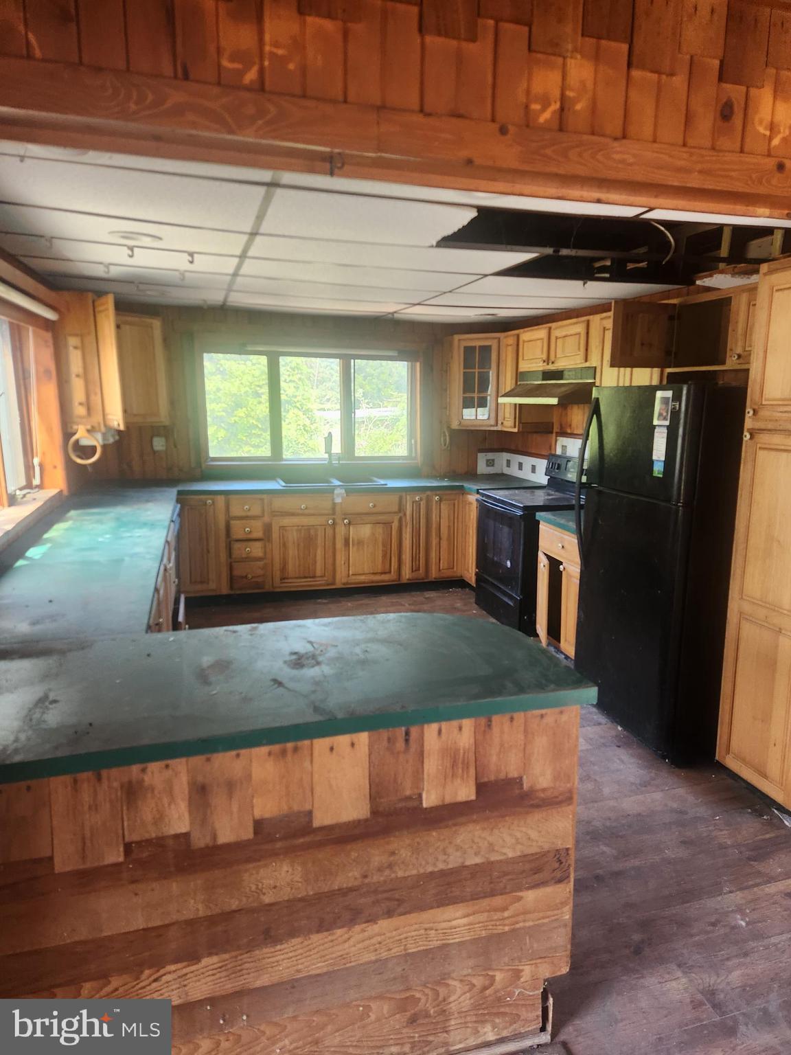 5573 Highway 9 Tuckerton, NJ 08087 - Photo 16 of 32 a kitchen with stainless steel appliances wooden cabinets a stove and a refrigerator