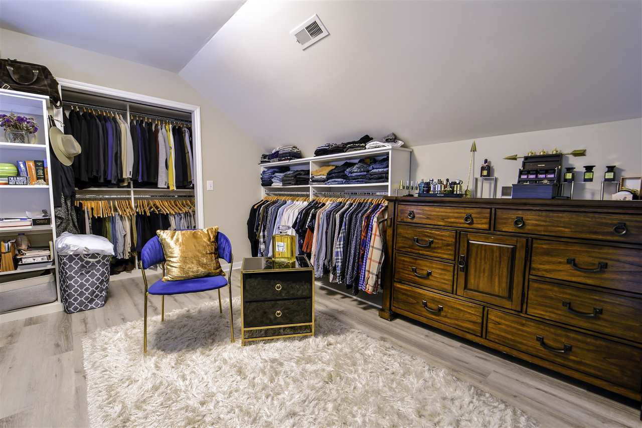 2523 Trout Stream Drive Raleigh, NC 27604 - Photo 21 of 23 Loft remodeled to a large closet w/ new plank flooring and light fixture. Loft
