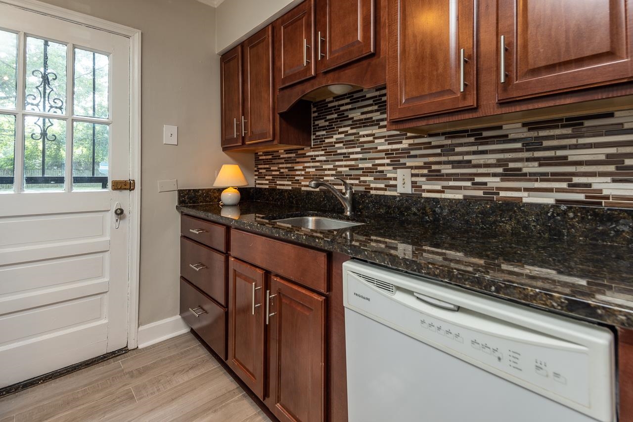 730 Shotwell Street Memphis, TN 38111 - Photo 11 of 20 a kitchen with granite countertop cabinets stainless steel appliances and a counter space