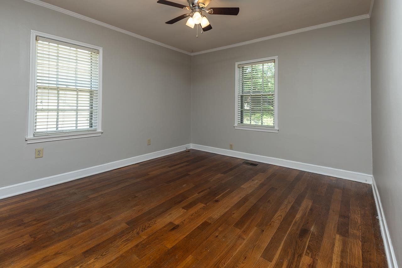 730 Shotwell Street Memphis, TN 38111 - Photo 15 of 20 a view of an empty room with wooden floor and a window