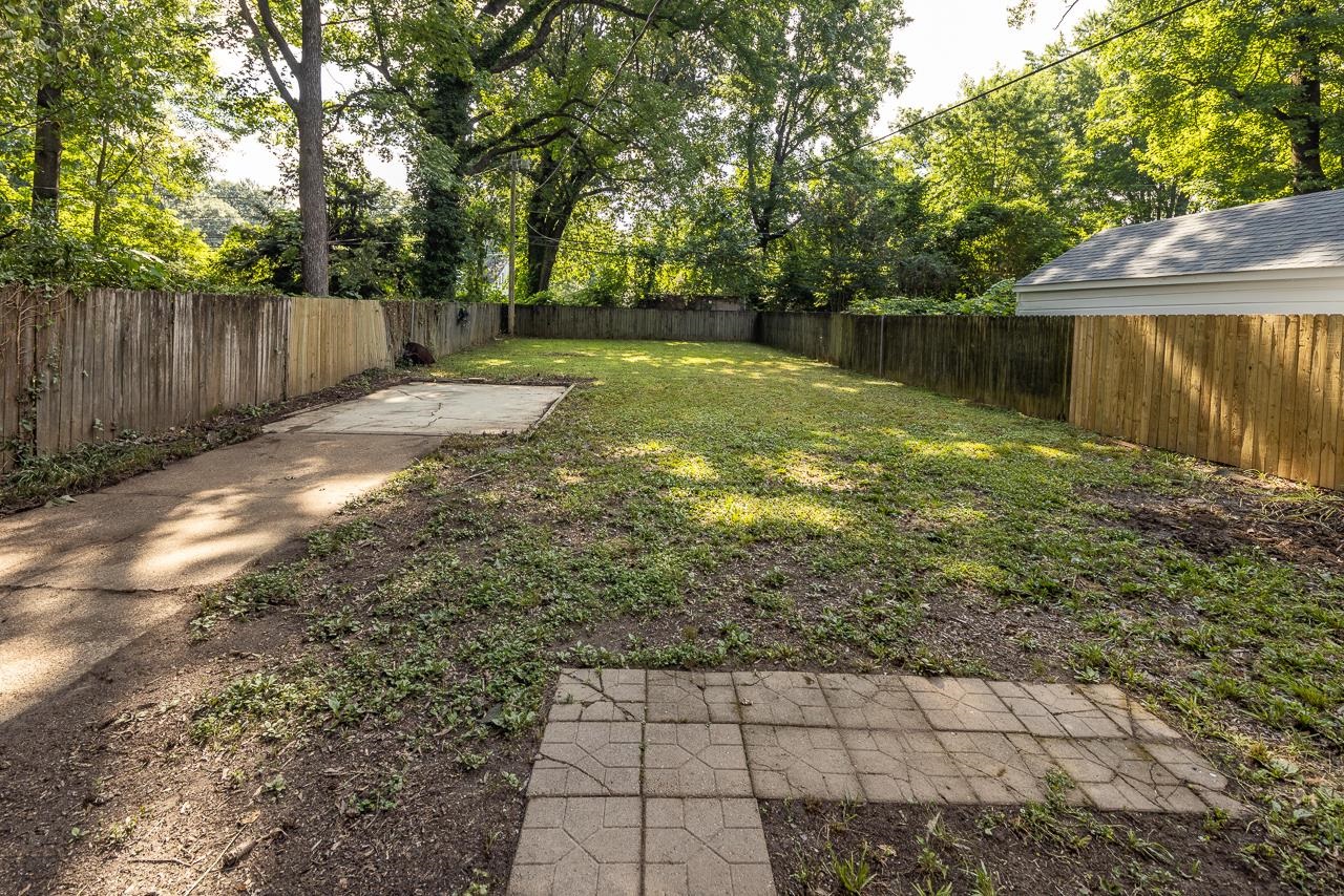 730 Shotwell Street Memphis, TN 38111 - Photo 17 of 20 a backyard of a house with lots of green space