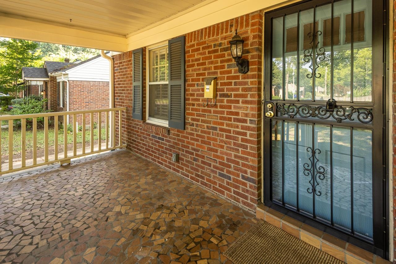 730 Shotwell Street Memphis, TN 38111 - Photo 4 of 20 a view of a balcony with a floor to ceiling window next to a building