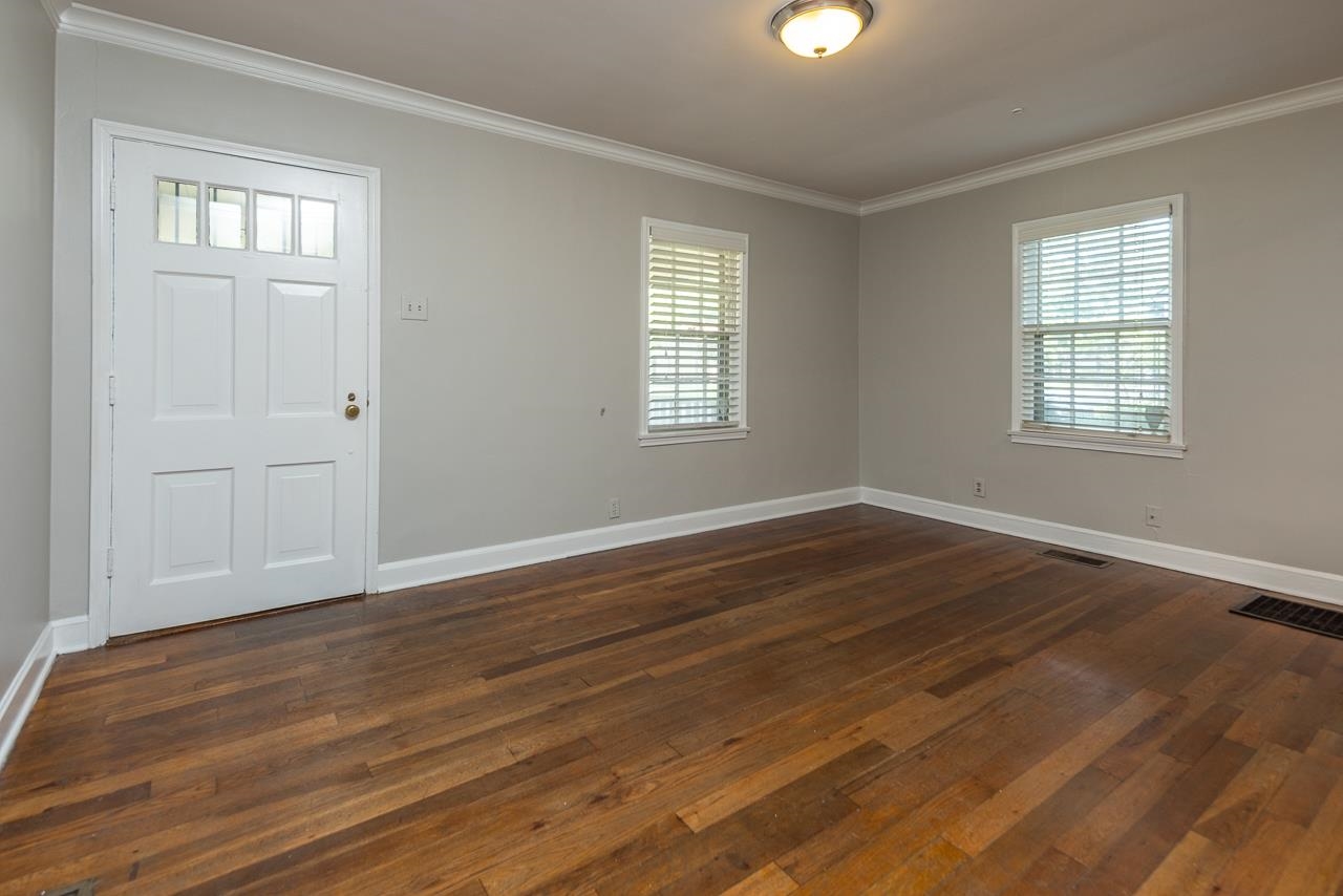 730 Shotwell Street Memphis, TN 38111 - Photo 6 of 20 an empty room with wooden floor and windows