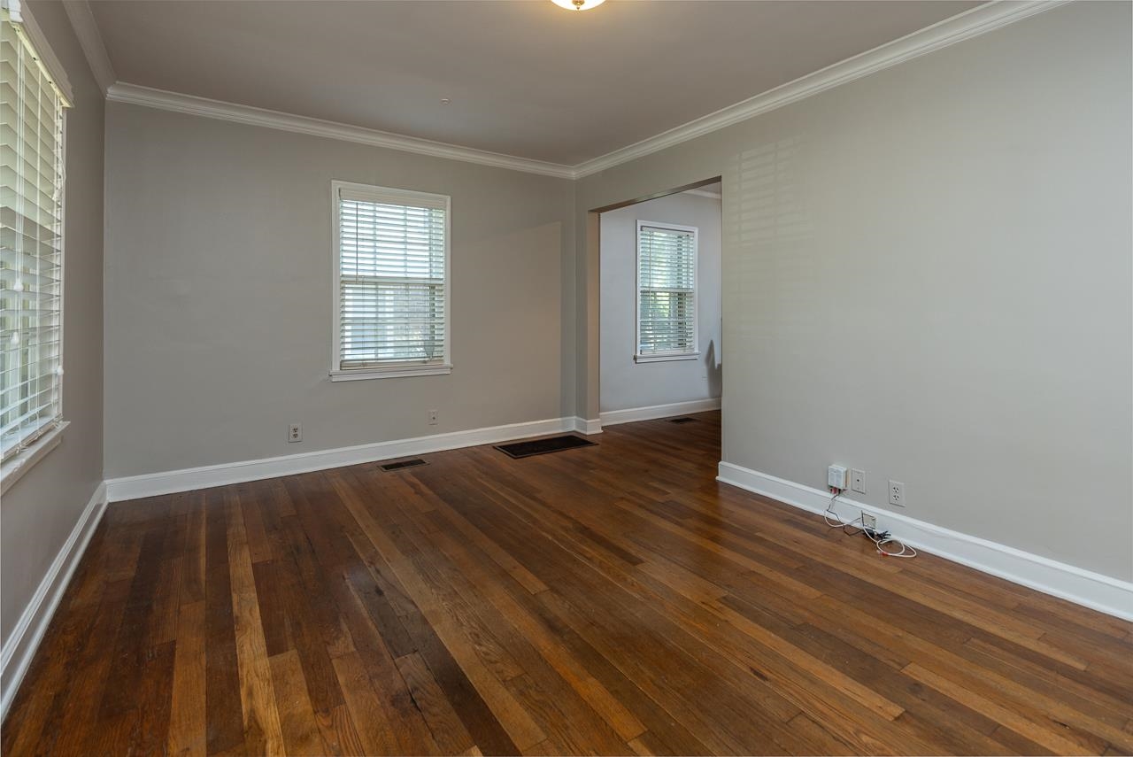 730 Shotwell Street Memphis, TN 38111 - Photo 7 of 20 an empty room with wooden floor and windows
