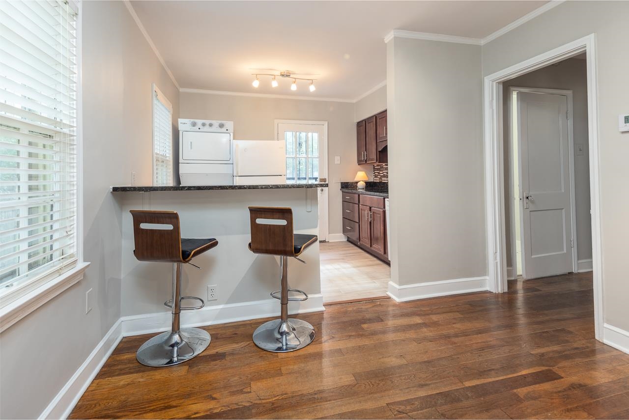 730 Shotwell Street Memphis, TN 38111 - Photo 9 of 20 a view of a kitchen with wooden floor and chair