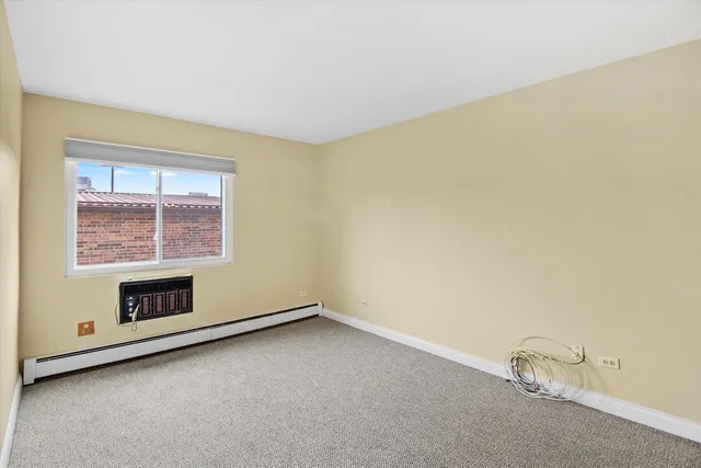 a kitchen with a refrigerator stove and white cabinets