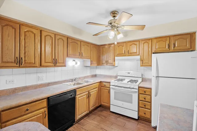 a kitchen with sink cabinets and window