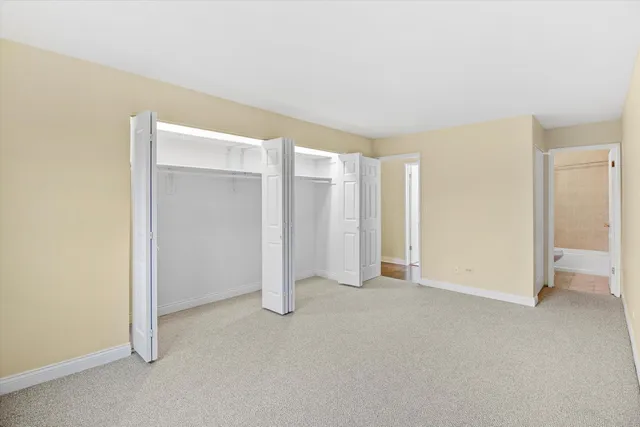 an empty room with a empty space and windows