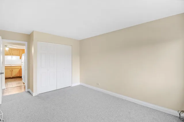 an empty room with a empty space and windows
