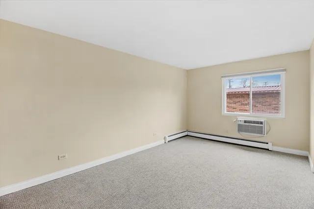 an empty room with a empty space and windows