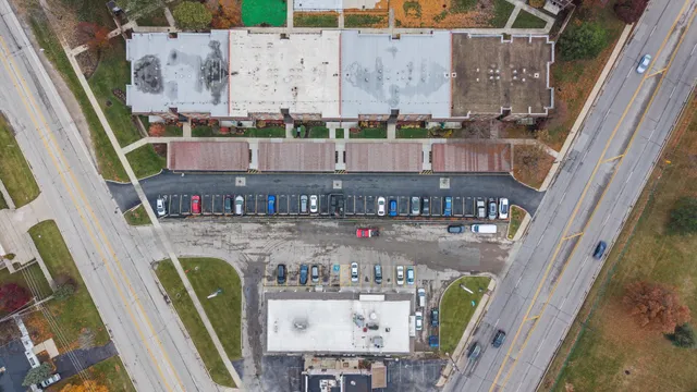 an aerial view of a house with a yard