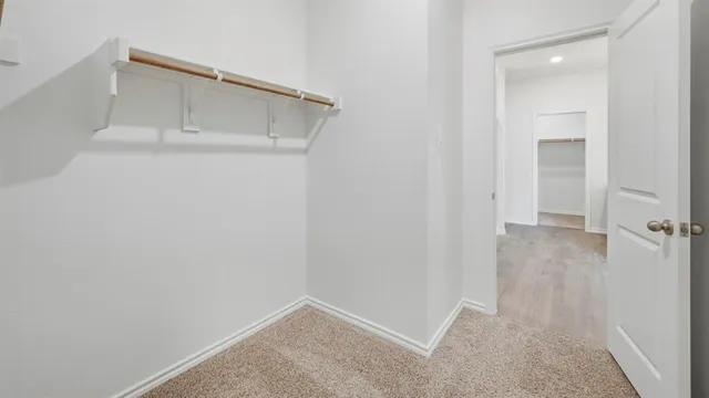 a view of an empty walk in closet