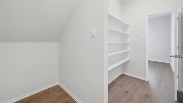 a view of an empty walk in closet