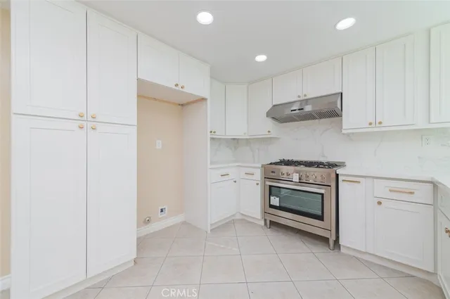 a kitchen with a stove and a sink