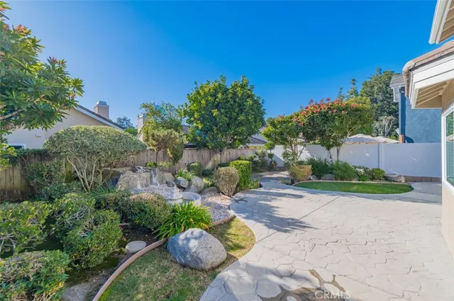 a view of a garden with a patio