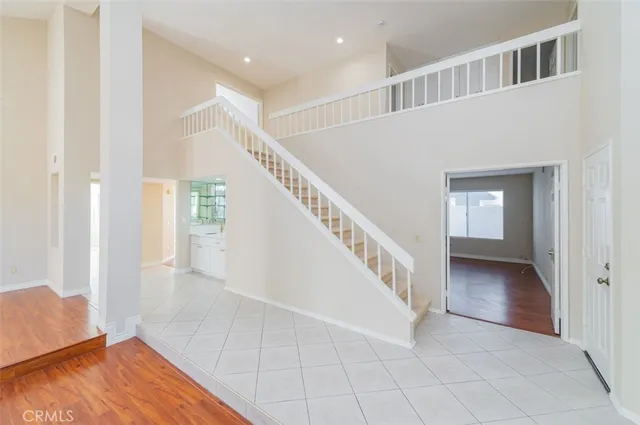 a view of an entryway with wooden floor