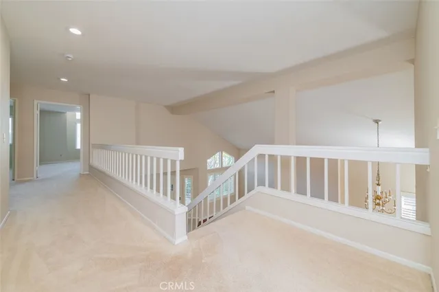 a view of staircase with white floor and windows