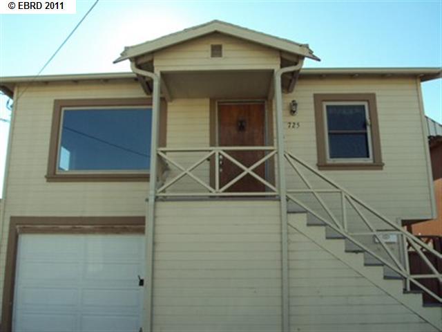 725 Second Street Rodeo, CA 94572 - Photo 1 of 1 a front view of a house with parking