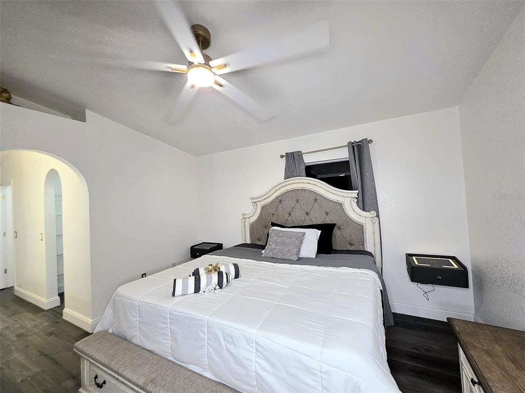 24921 Ravello Street Land O Lakes, FL 34639 - Photo 11 of 36 a bedroom with a bed and a ceiling fan