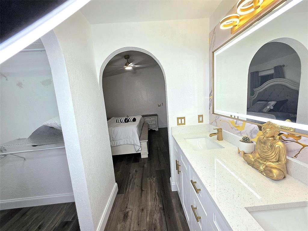 24921 Ravello Street Land O Lakes, FL 34639 - Photo 33 of 36 a en suite bathroom with a double vanity sink and a mirror