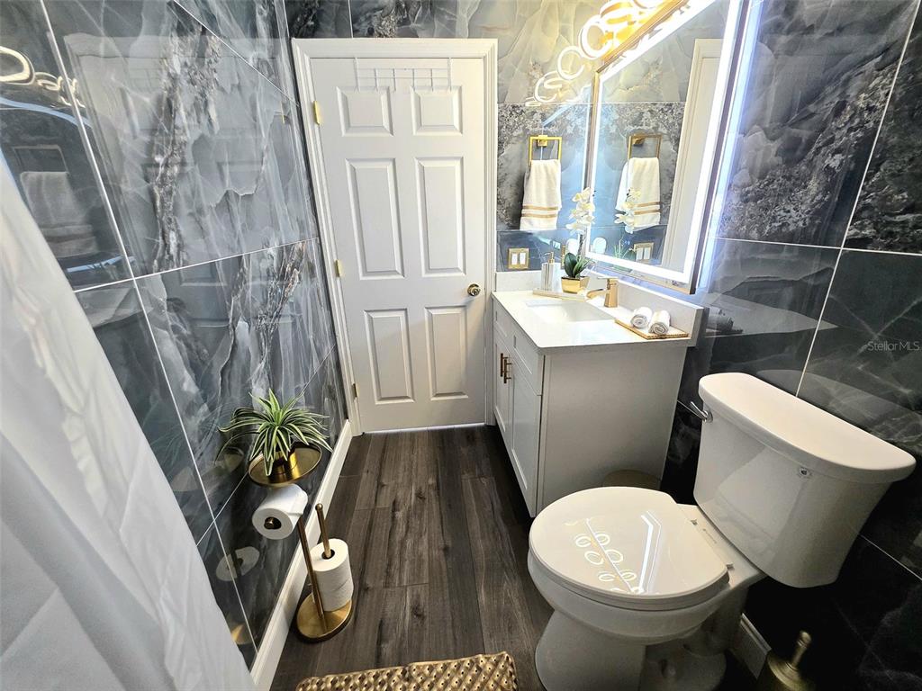 24921 Ravello Street Land O Lakes, FL 34639 - Photo 5 of 36 a bathroom with a toilet and a sink