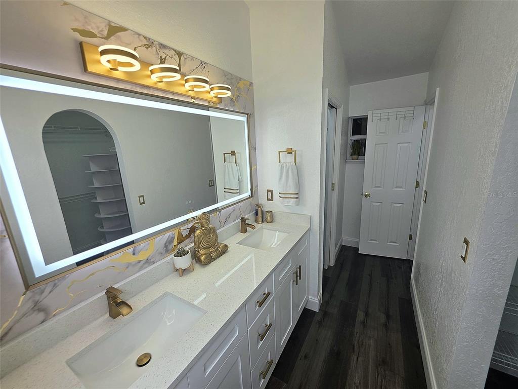 24921 Ravello Street Land O Lakes, FL 34639 - Photo 9 of 36 a spacious bathroom with a bathtub and a sink