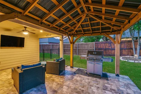 a view of a backyard with sitting area
