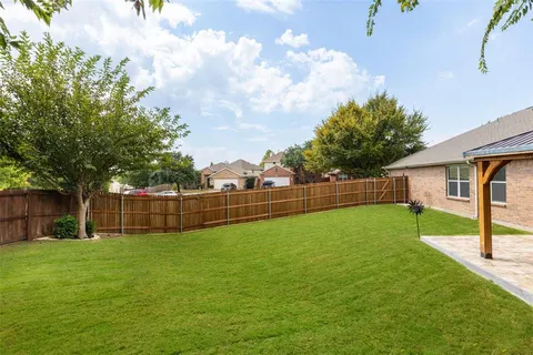 a view of a backyard with a garden