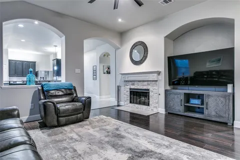 a living room with furniture and a fireplace