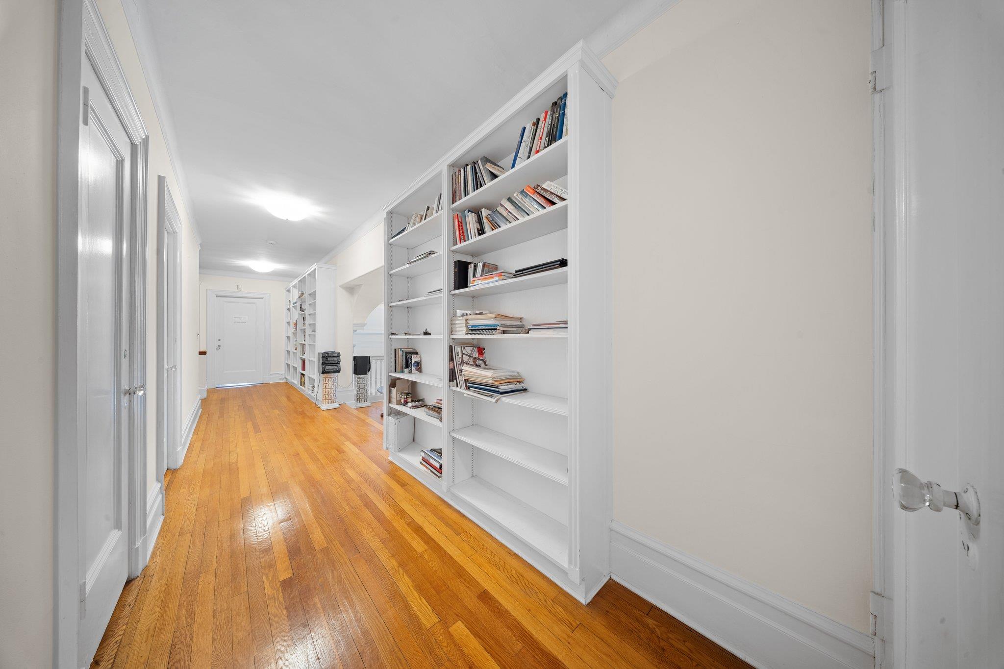 10-08 Shore Road Queens, NY 11363 - Photo 20 of 47 a view of a room with wooden floor and windows