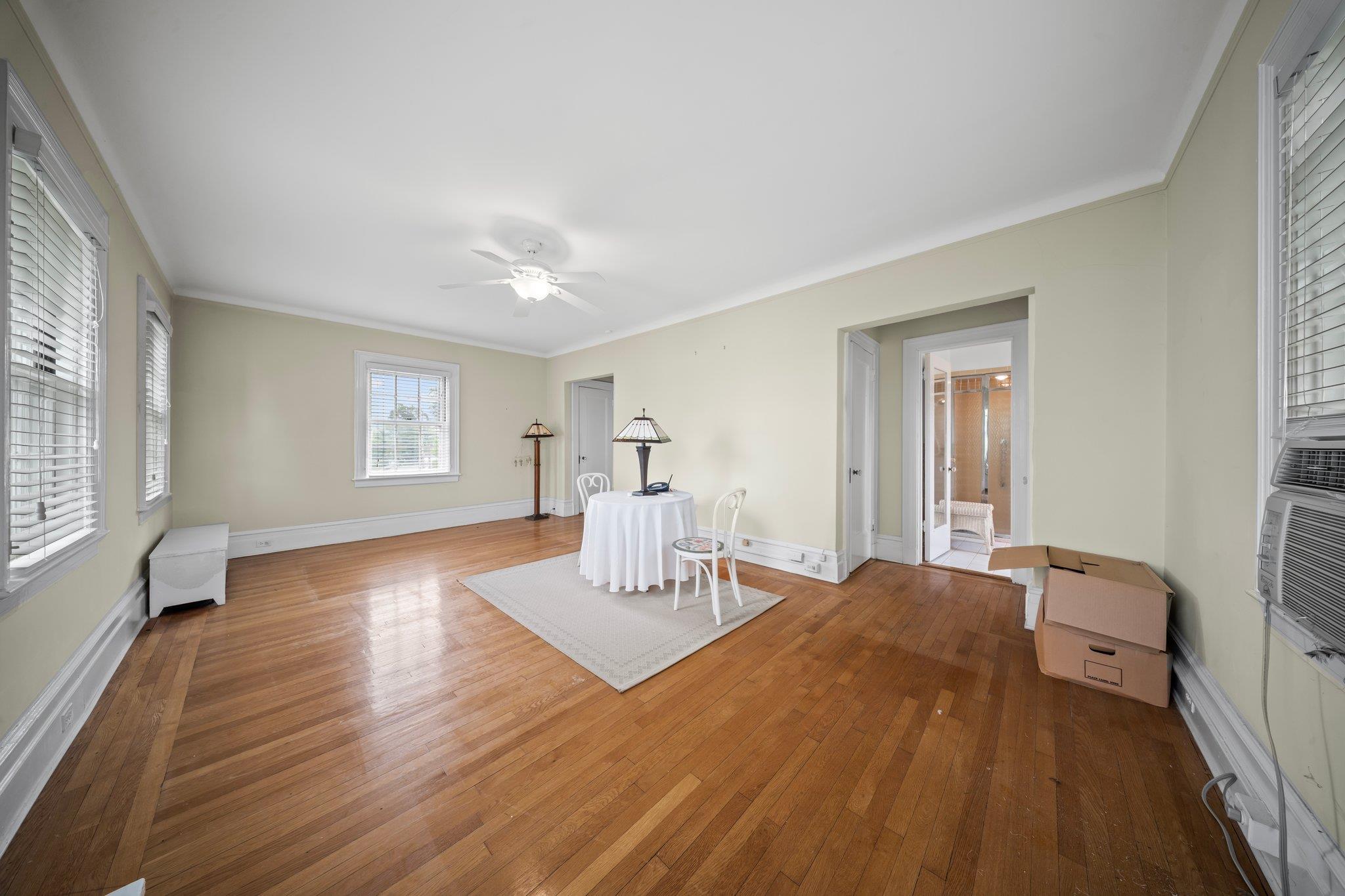 10-08 Shore Road Queens, NY 11363 - Photo 21 of 47 a bedroom with a bed and wooden floor
