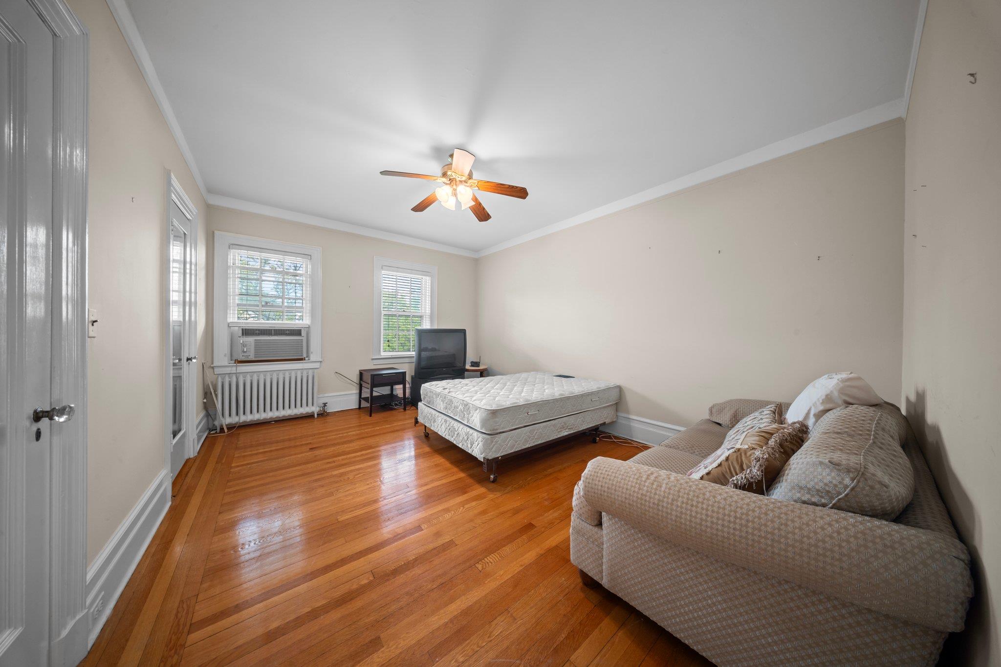 10-08 Shore Road Queens, NY 11363 - Photo 24 of 47 a living room with furniture and wooden floor
