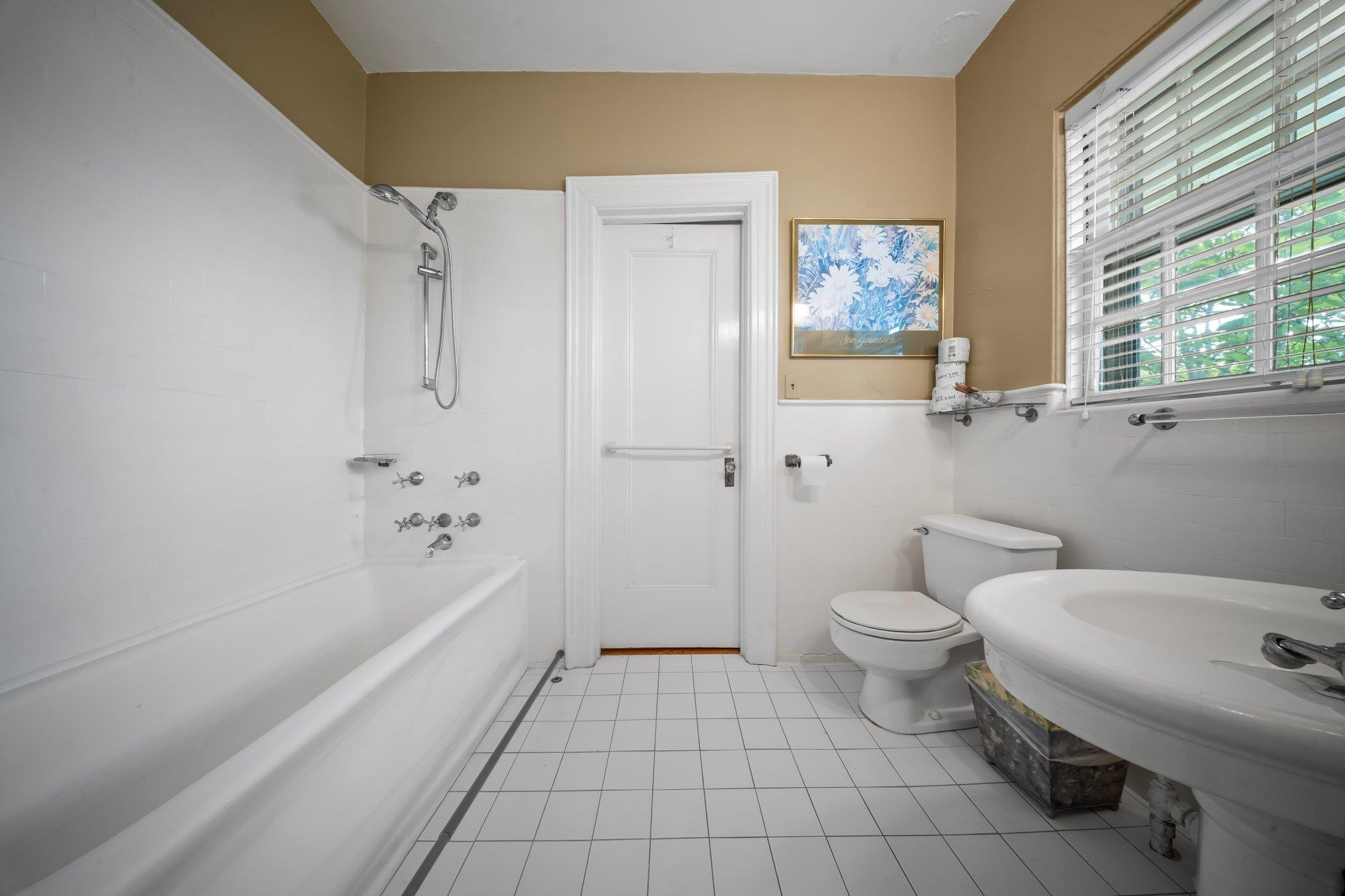 10-08 Shore Road Queens, NY 11363 - Photo 26 of 47 a bathroom with a sink a toilet and shower