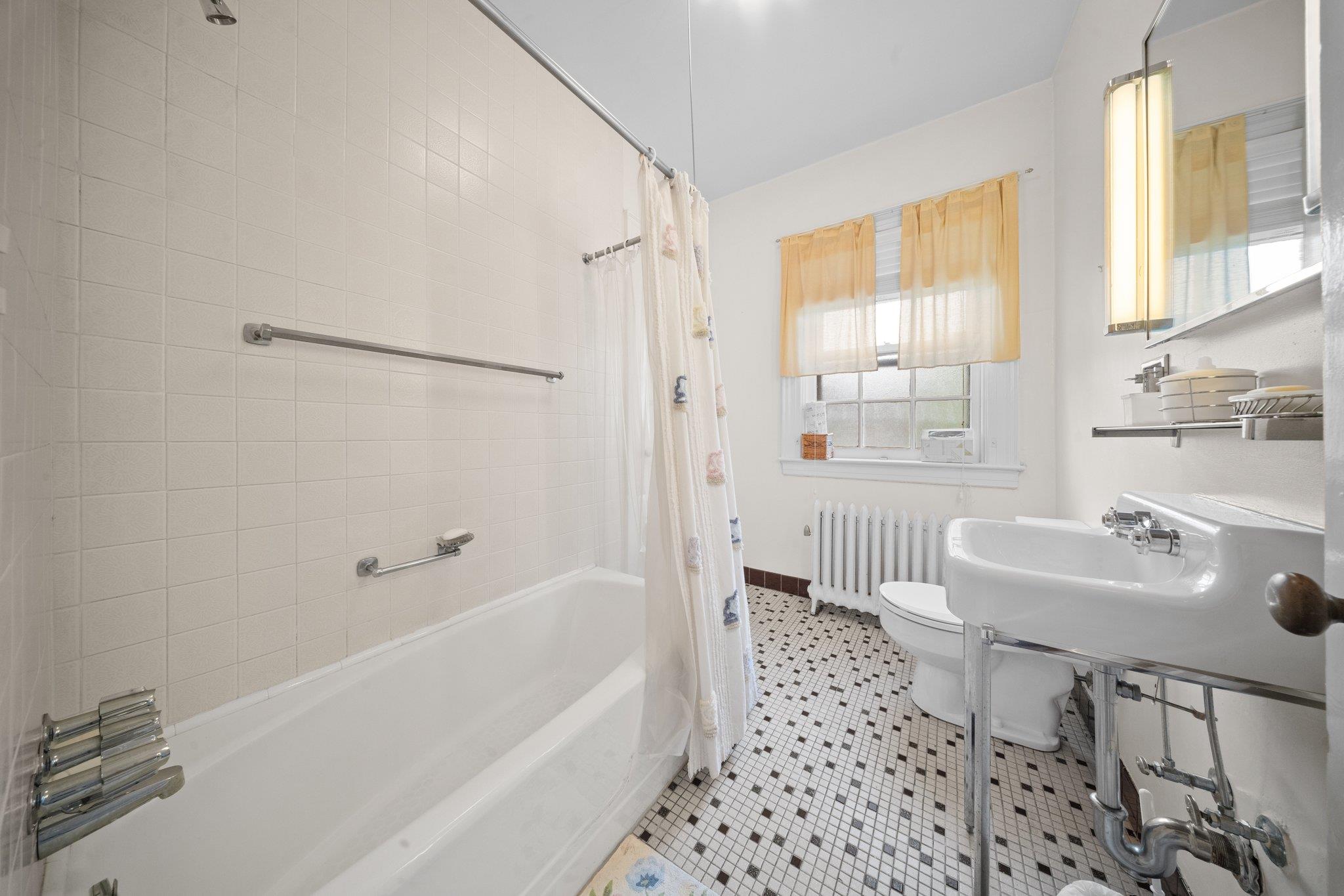 10-08 Shore Road Queens, NY 11363 - Photo 28 of 47 a bathroom with a sink toilet and shower