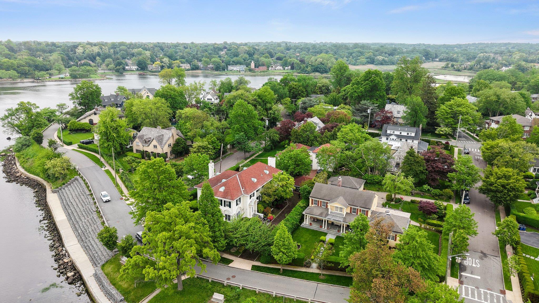 10-08 Shore Road Queens, NY 11363 - Photo 41 of 47 a view of a lake with a building in the background