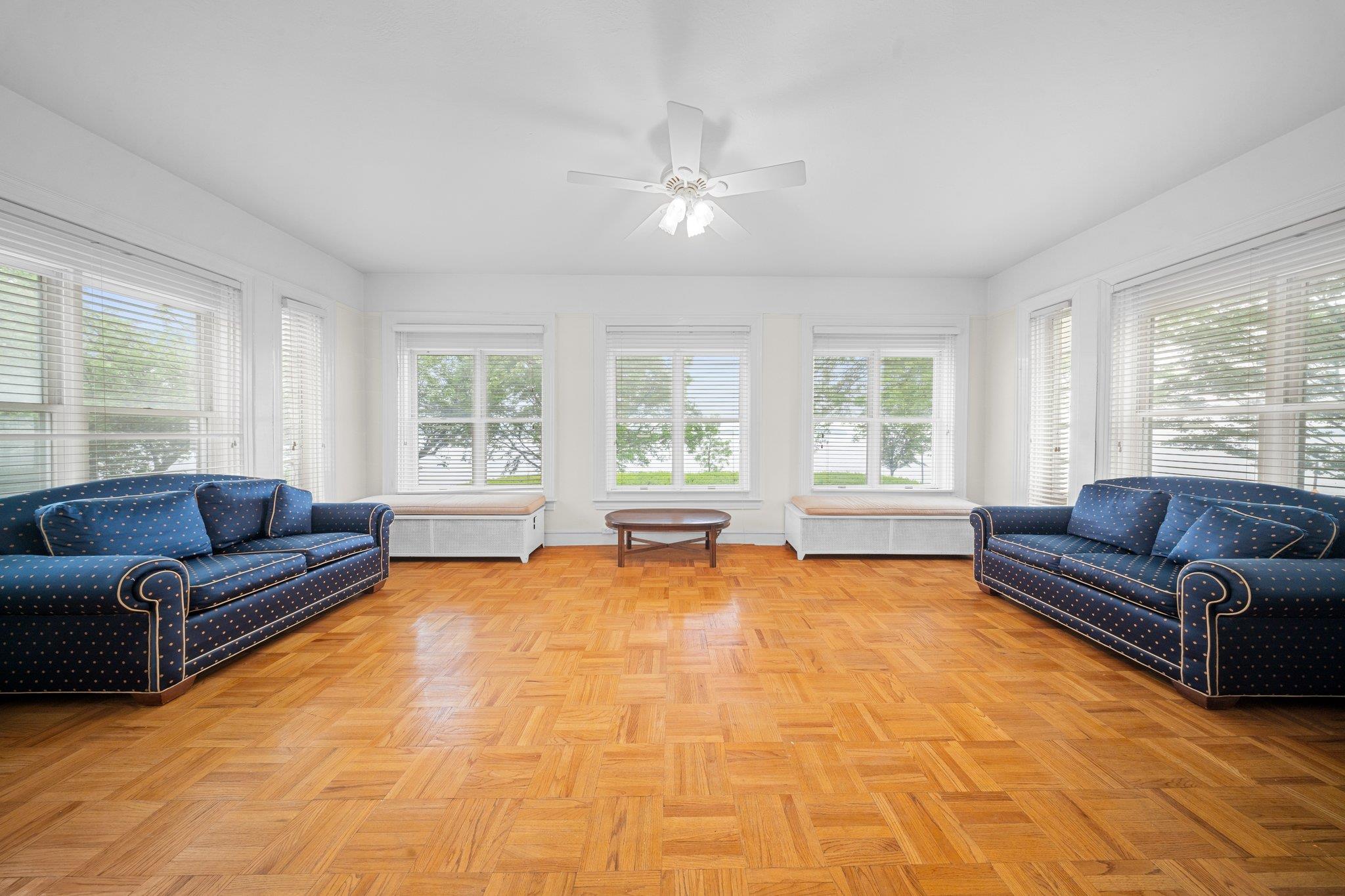 10-08 Shore Road Queens, NY 11363 - Photo 7 of 47 a living room with furniture and a large window