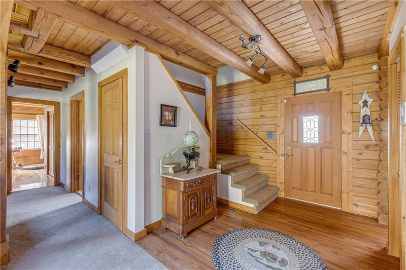 171 Davis Road Valencia, PA 16059 - Photo 8 of 25 Center Foyer with Beamed Ceilings and hardwood flooring.