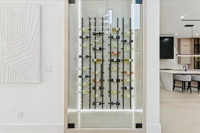 a living room with furniture a fireplace and a large window